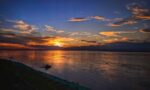 Assam Flood 2026: बाढ़ ने छीनी 75 जिंदगियां, लाखों लोग बेघर — एक दर्दभरी तस्वीर Brahmaputra river in Assam, whose flooding affects lakhs of people every monsoon